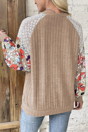 Chic Print Silhouette Top in Dust Storm with floral print sleeves and lace shoulder detail.