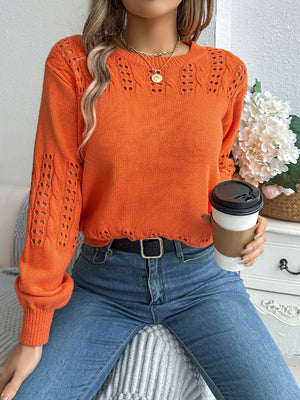 Openwork knit sleeve sweater in gray, pumpkin, or black acrylic.