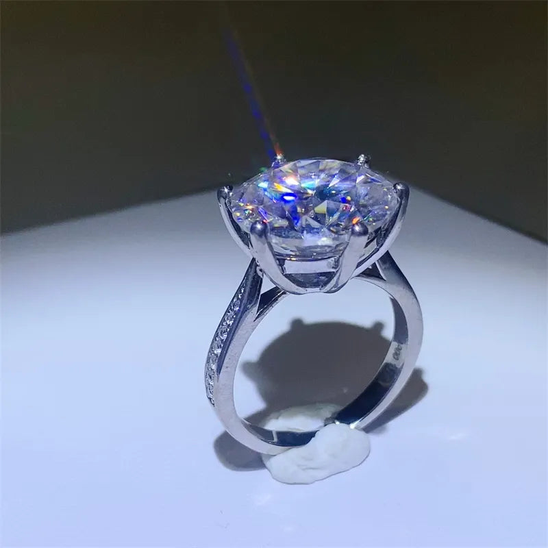 Prismatic Halo Silver Engagement Ring with a large, brilliant-cut center stone and pavé band.