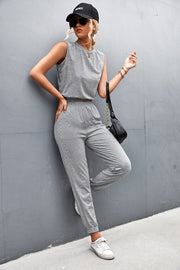 Gray Dawn cropped muscle tank and jogger set with elastic waistband and cuffs.