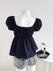 Navy polka dot maternity blouse with puff sleeves and square neckline