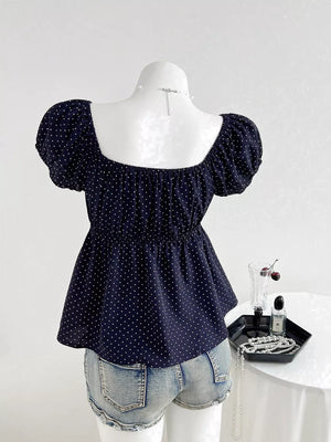 Navy polka dot maternity blouse with puff sleeves and square neckline