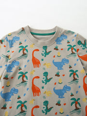 Toddler crew-neck tee in grey cotton with a colorful dinosaur and palm tree print.