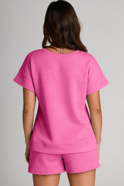 Fuchsia pink quilted tee and shorts set with geometric pattern.