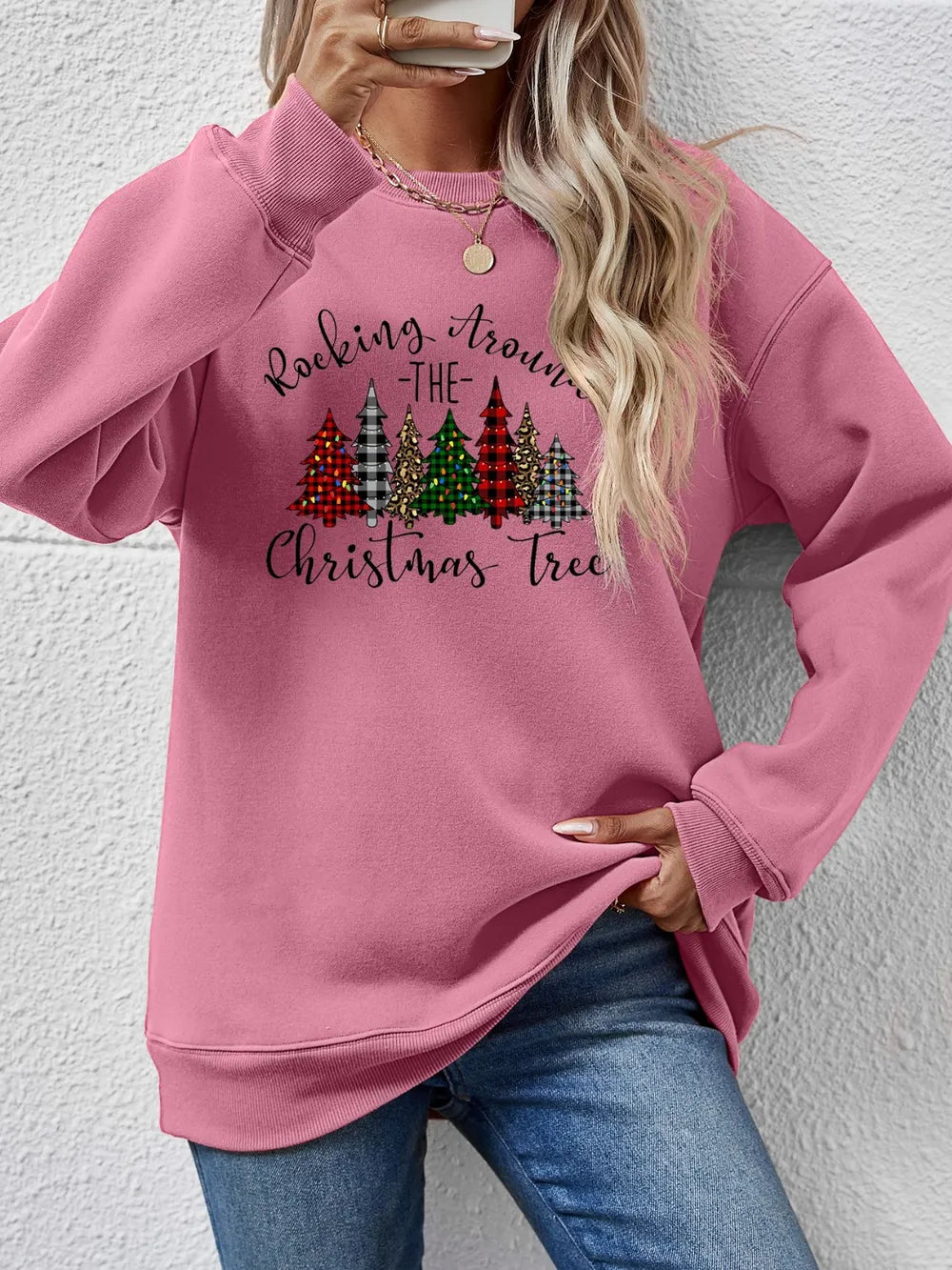 Graphic Christmas Tree Crewneck Sweatshirt in Blush Pink with festive tree print and text.