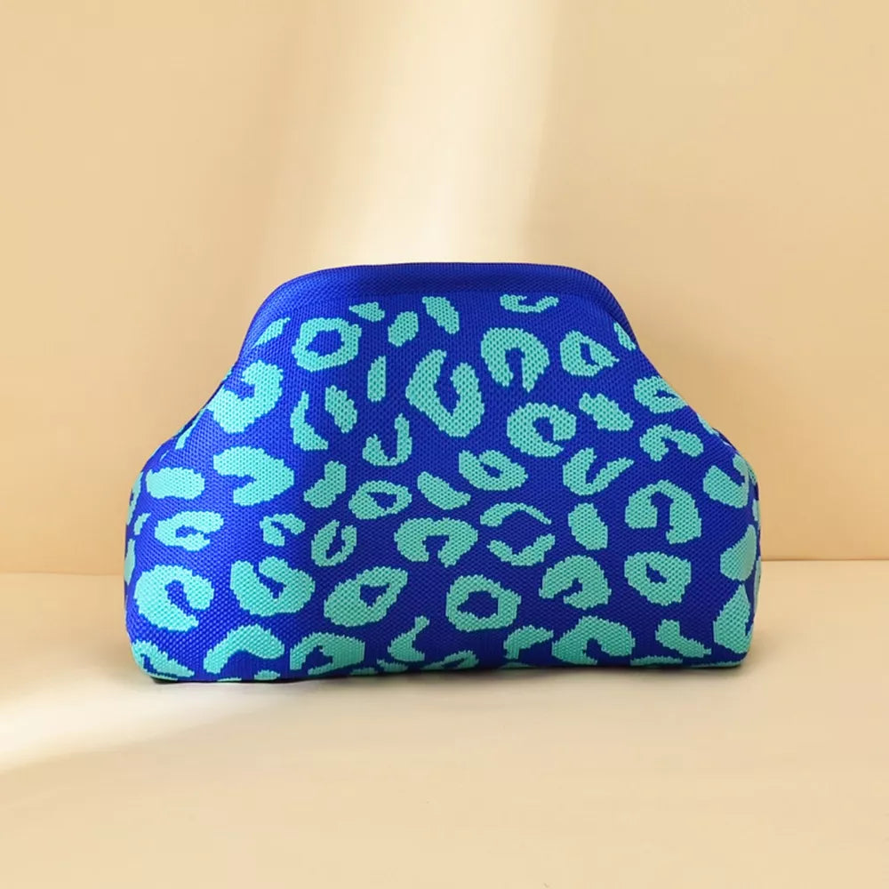 Vibrant knit clutch in blue with teal leopard print.