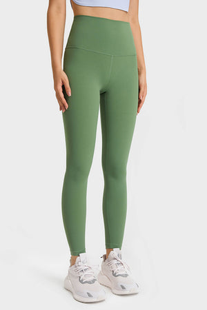 Green high rise leggings with a seamless waistband and full length.