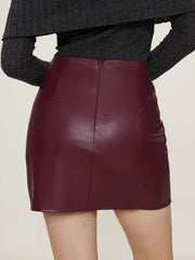 Burgundy faux leather asymmetric mini skirt with back zipper detail