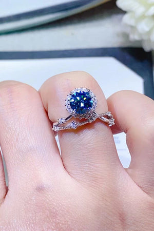 Sky blue moissanite halo engagement ring set with diamond band