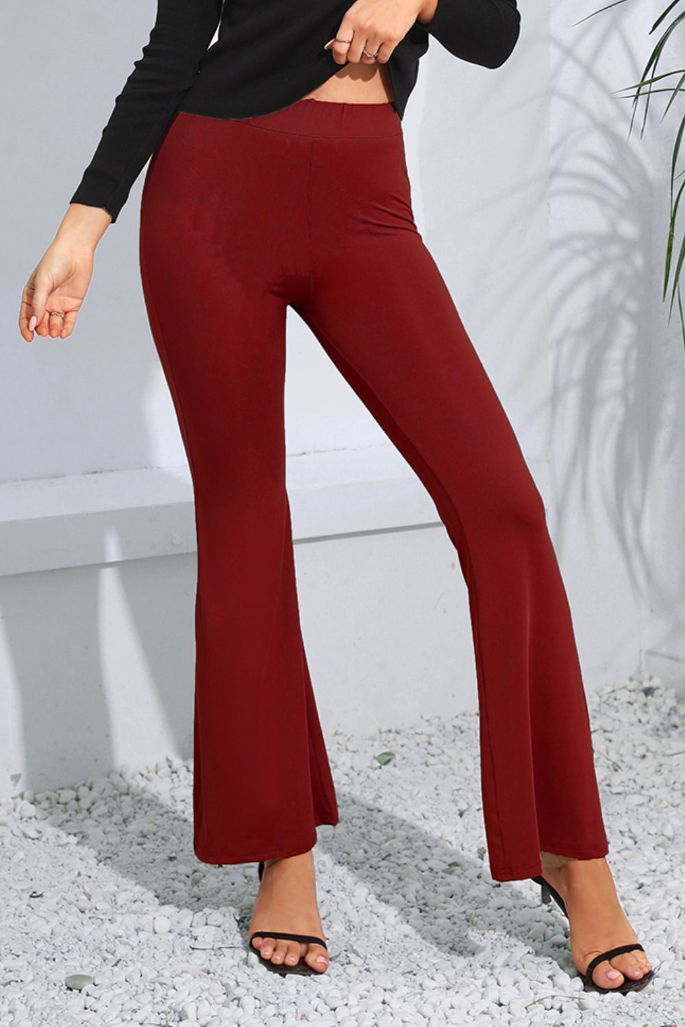 Sculpted flare leggings in wine, high-waisted, form-fitting with a flared hem.