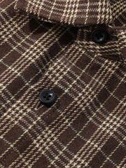 Classic oversized plaid button-front shirt in chocolate brown with cream plaid detail and black buttons.