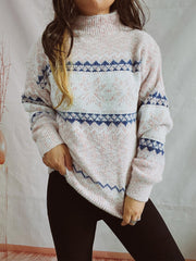 Geometric knit mockneck pullover in pastel pink with blue and white fair isle pattern.