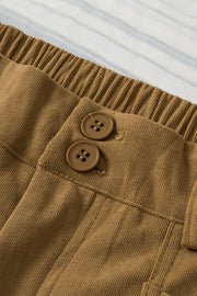 Caramel seamed front wide leg trousers with elastic waistband and two button details.