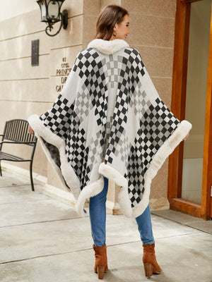 Diamond checkered poncho in ivory with faux fur trim and collar.
