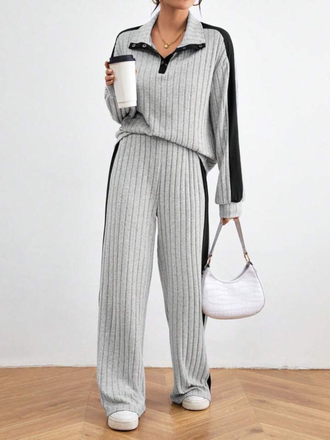 Light gray ribbed polo lounge set with contrast trim and snap button detail.