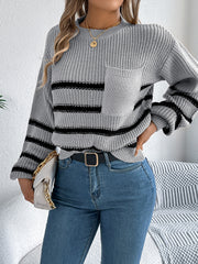 Gray striped knit sweater with chest pocket and crew neck.