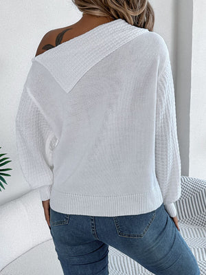 White off-shoulder cable knit pullover sweater with textured sleeves.