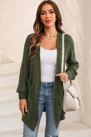 Matcha green cable knit open-front cardigan with pockets.