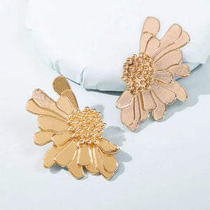 Textured gold flower stud earrings with beaded centers and layered petals.