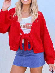 Textured tie-front knit cardigan in scarlet with chunky knit and balloon sleeves.