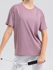 Dusty Pink performance tee with seam details, crew neck, and short sleeves.