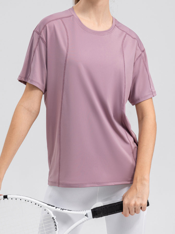 Dusty Pink performance tee with seam details, crew neck, and short sleeves.