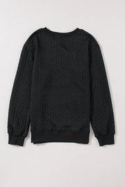 Black textured sweatshirt with cable knit pattern and crew neck.