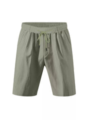 Lightweight green chino shorts with elastic drawstring waist and side pockets.
