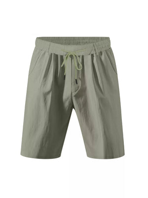 Lightweight green chino shorts with elastic drawstring waist and side pockets.