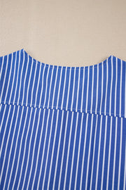 Blue and white striped blouse with a tie-front detail and puff sleeves.