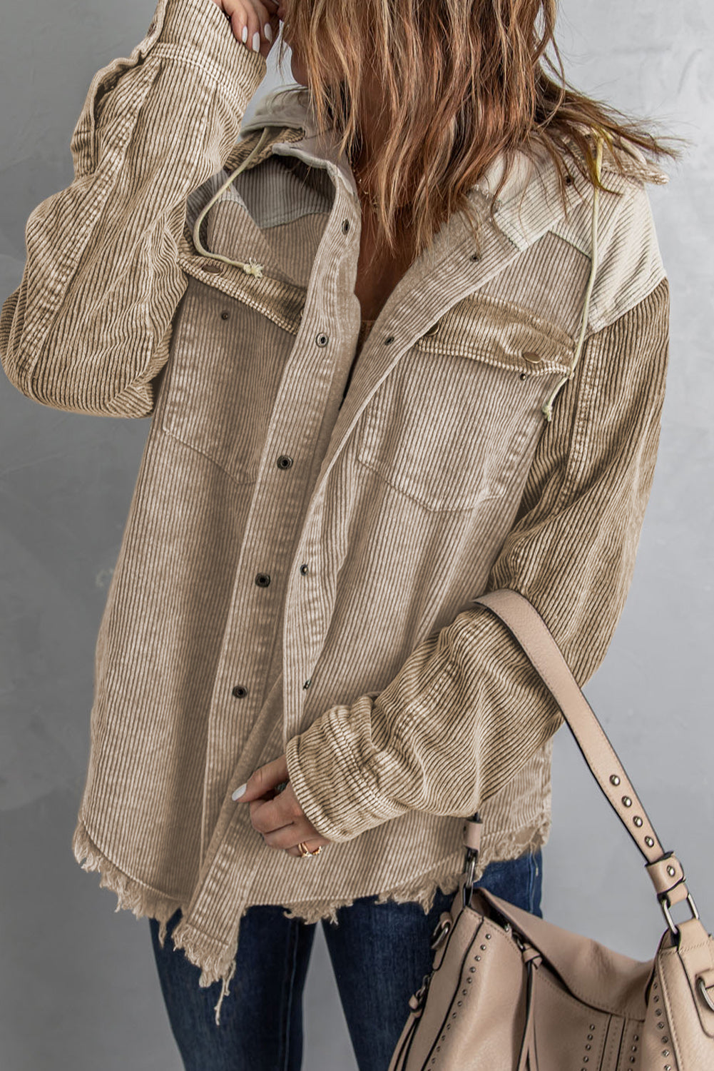 Colorblock corduroy hooded utility jacket in tan with frayed hem and chest pockets.