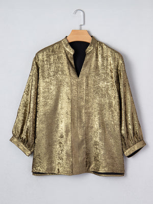 Gold crinkled blouse with 3/4 sleeves and notched V-neck.