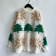 Cream knit sweater with green Christmas trees and tan snowflake appliqués.