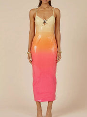 Sequined cami dress with starfish detail and orange to pink gradient.