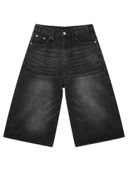 Black wide-leg distressed denim culottes with button fly and metal ring detail.
