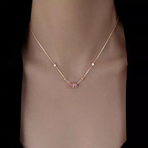 Rose gold necklace with bezel-set zircon cluster pendant and small clear stones