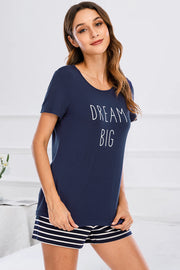 Dark blue graphic tee with "DREAM BIG" text and striped shorts pajama set.