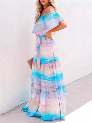Off-shoulder tiered maxi dress with watercolor gradient print and tie waist.