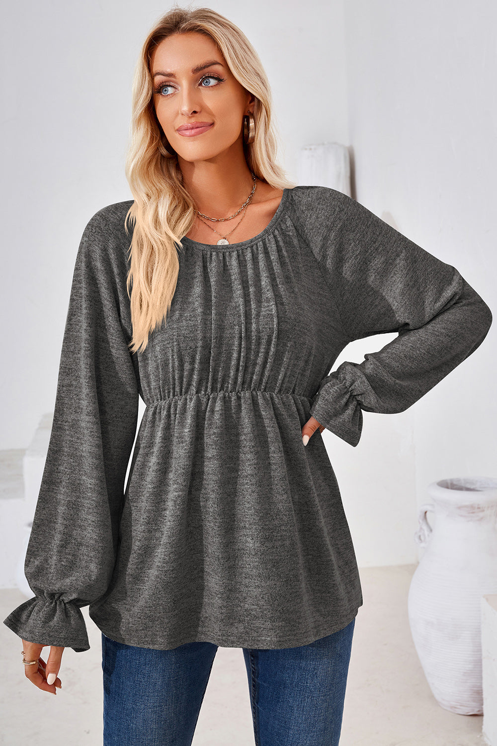 Dark Gray peasant blouse with gathered neckline, cinched waist, and ruffled cuffs.