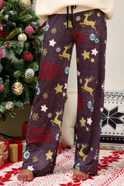 Festive print wide-leg lounge trousers in dusty purple with reindeer, stars, and Merry Christmas text.