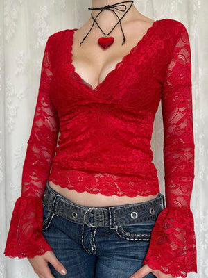 Deep red lace bell sleeve surplice blouse with scalloped trim.