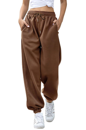 Relaxed-fit cuffed sweatpants in coffee brown with drawstring waist and pockets.