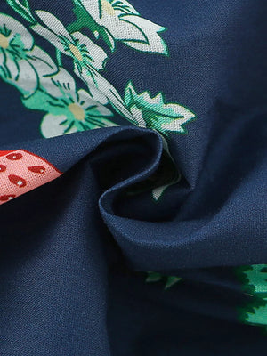 Navy cotton dress with strawberry and floral print, ruffle sleeve detail.