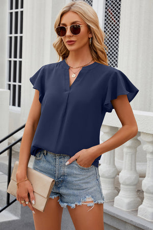Dark blue flutter sleeve v-neck blouse with a relaxed fit.