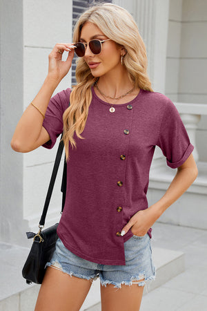 Burgundy asymmetric button-up tee with short sleeves and a round neckline.
