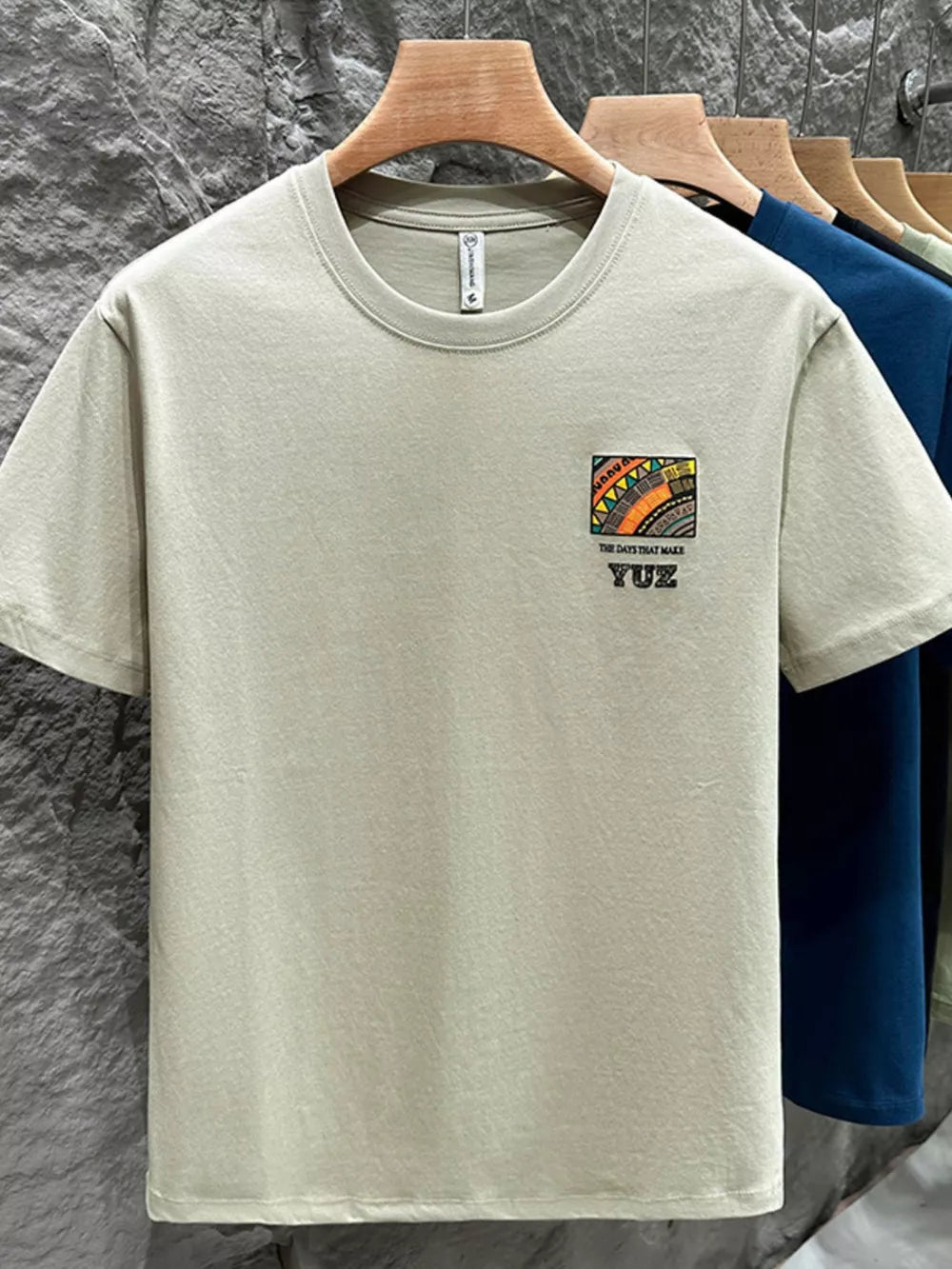 Men's Matcha Green cotton crew t-shirt with abstract graphic detail and text.