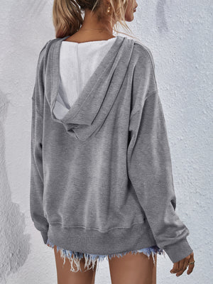 Heather gray boxy hooded sweatshirt with split hem and fleece lining.