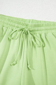 Lime cotton lounge shorts with elastic waistband and drawstring detail