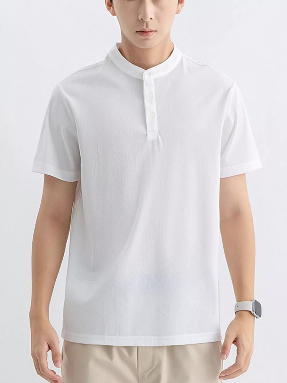 Men's white cotton short sleeve t-shirt with mandarin collar and button placket.