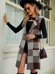 Geometric knit duster vest in brown and tan checkered pattern with pockets.